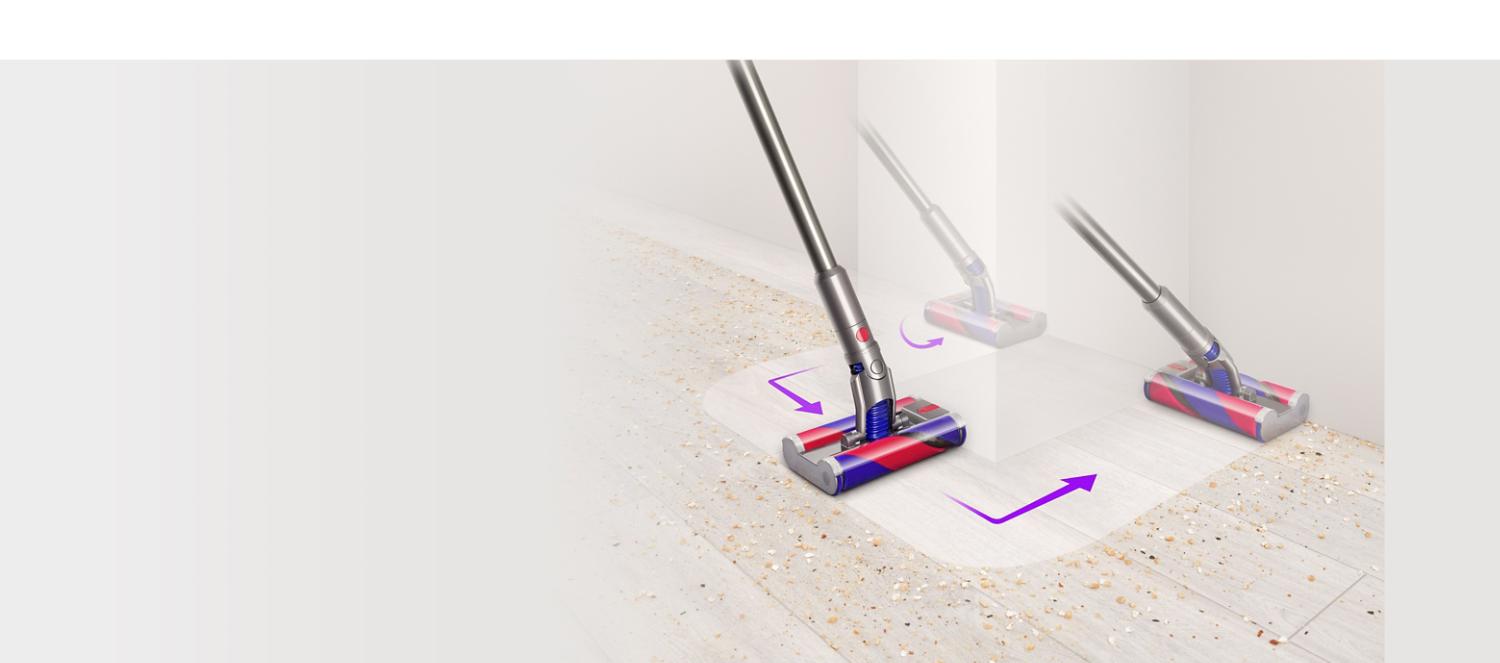 Brosse à rouleau doux omnidirectionnelle Dyson Fluffy™ manœuvrant autour d'un obstacle.